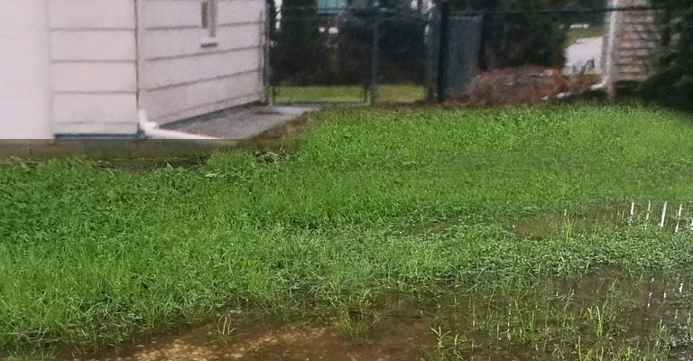 How To Stop Water Runoff From Neighbors Yard?