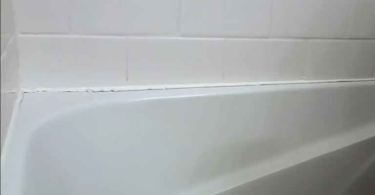 Is It OK To Caulk Over Grout