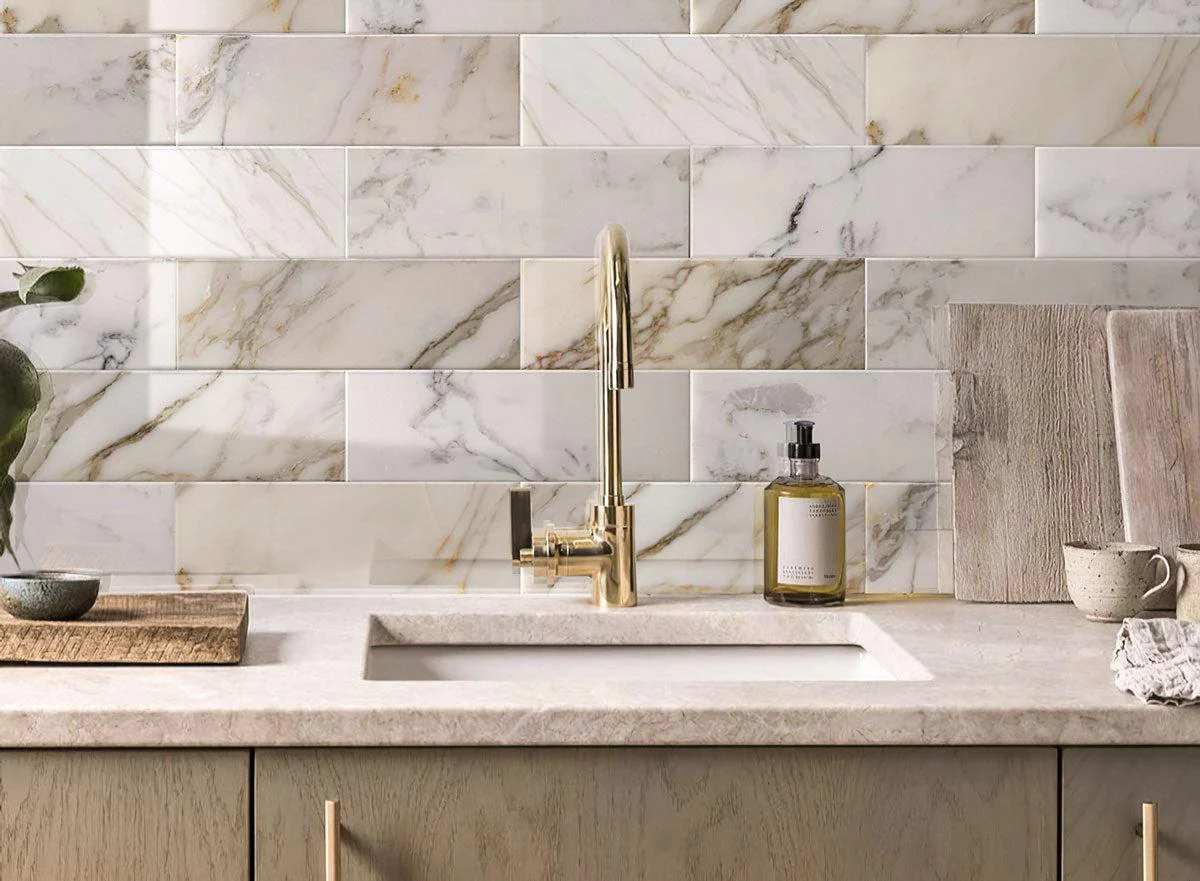 calacatta gold 4x12 polished marble tile kitchen 1f7ce1d8 e76b 4cd0 b6d8 86340f231033 Elevate Your Space: Unveiling This Year's Top Home Renovation Trends